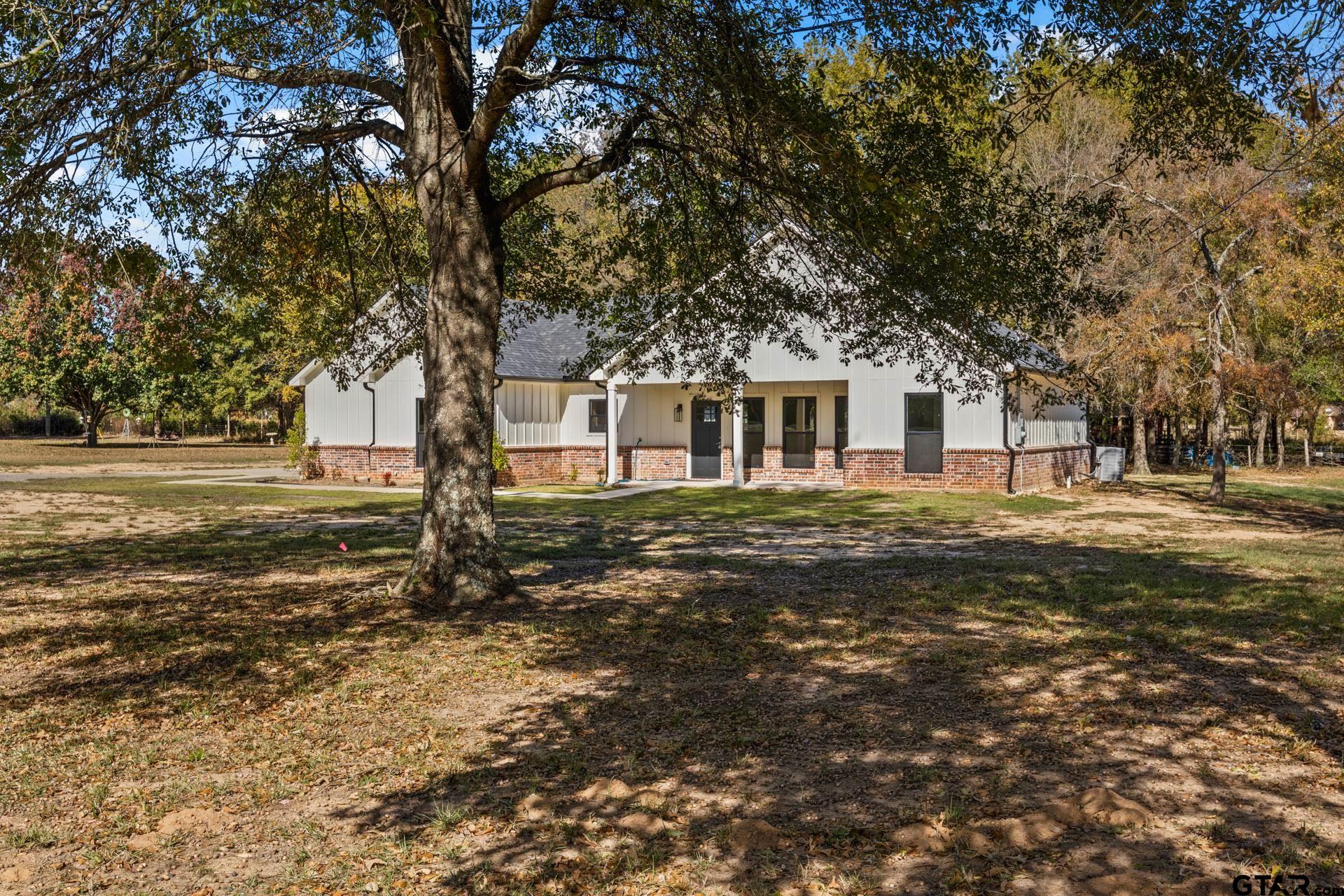 1339 Hwy 67 Mount Mount Vernon, TX 75457 - Photo 4 of 47 a front view of a house with a garden