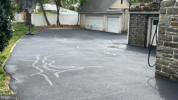 a view of a garage with an empty space