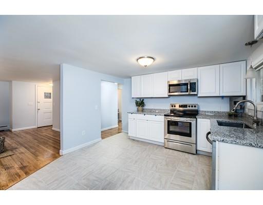 116 Stafford Road Holland, MA 01521 - Photo 7 of 24 a kitchen with granite countertop white cabinets and stainless steel appliances