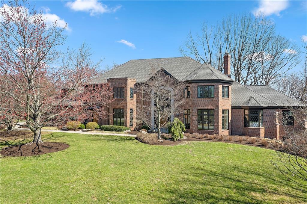 7 Meadowood Drive Pittsburgh, PA 15215 - Photo 1 of 45 a front view of a house with a yard fountain and large tree
