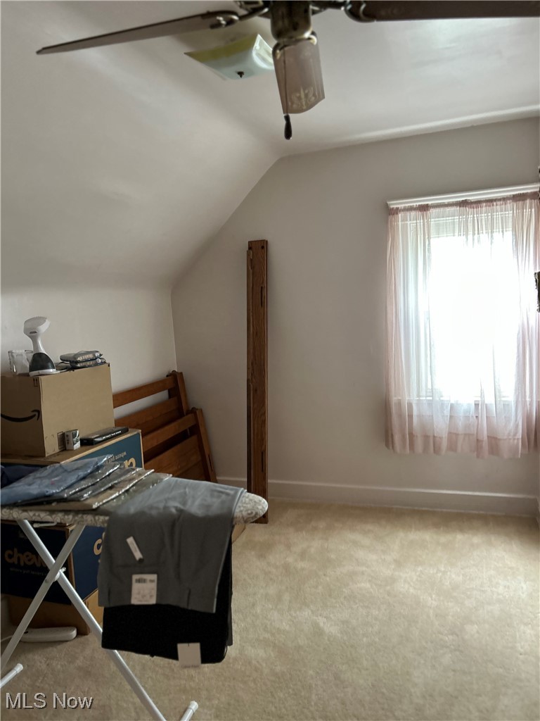 11406 Bellaire Road Cleveland, OH 44111 - Photo 14 of 28 Bedroom featuring carpet flooring, lofted ceiling, and ceiling fan