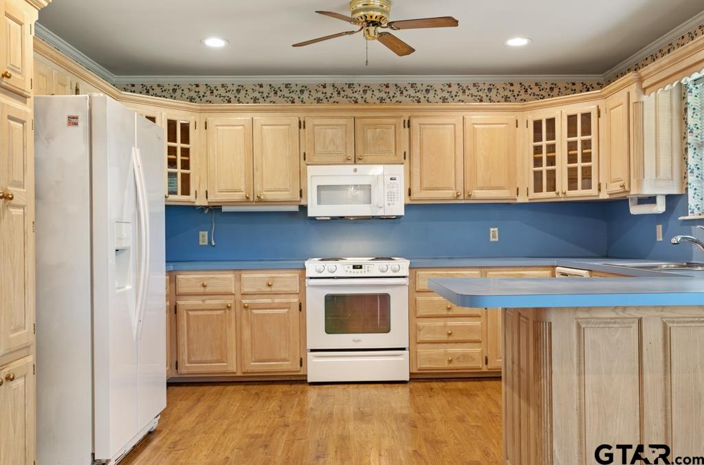 14762 County Road 3147 Tyler, TX 75706 - Photo 12 of 48 a kitchen with stainless steel appliances granite countertop a stove a sink and a refrigerator