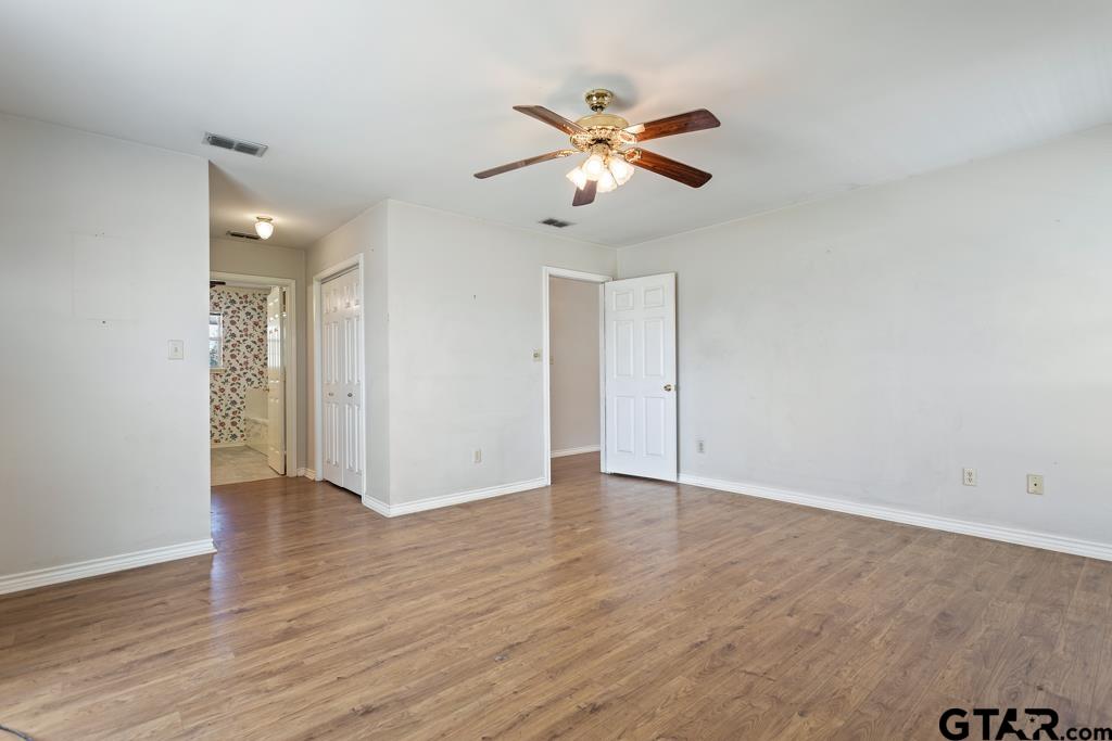 14762 County Road 3147 Tyler, TX 75706 - Photo 14 of 48 a view of an empty room and wooden floor