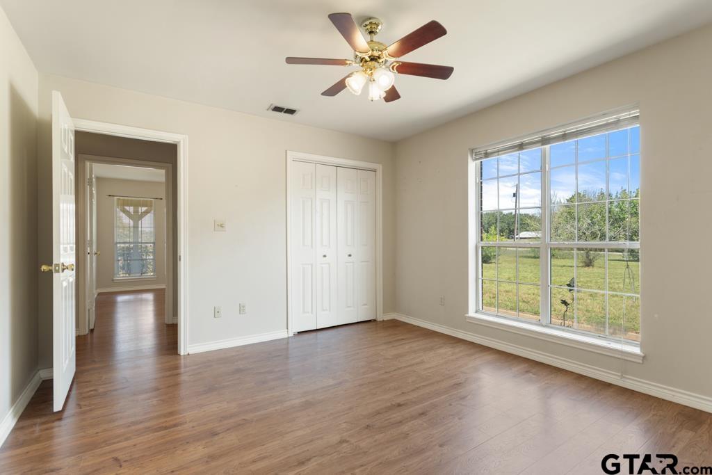 14762 County Road 3147 Tyler, TX 75706 - Photo 20 of 48 a view of an empty room with a window and wooden floor