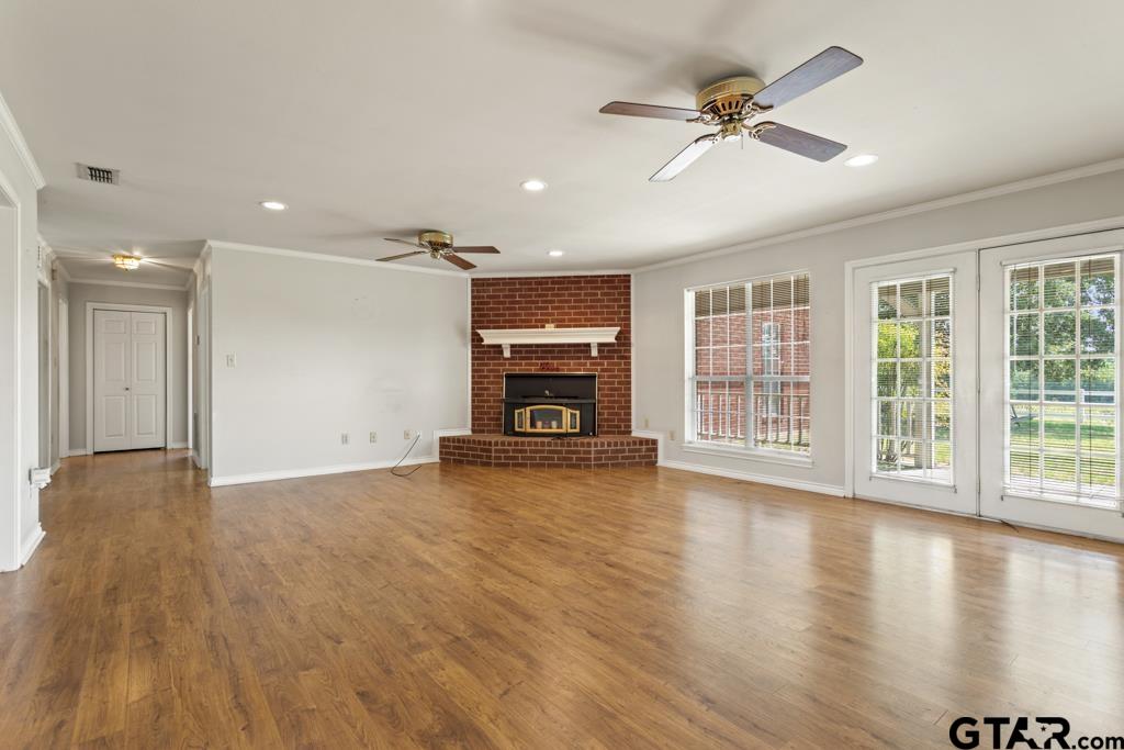 14762 County Road 3147 Tyler, TX 75706 - Photo 7 of 48 a view of empty room with wooden floor and fan