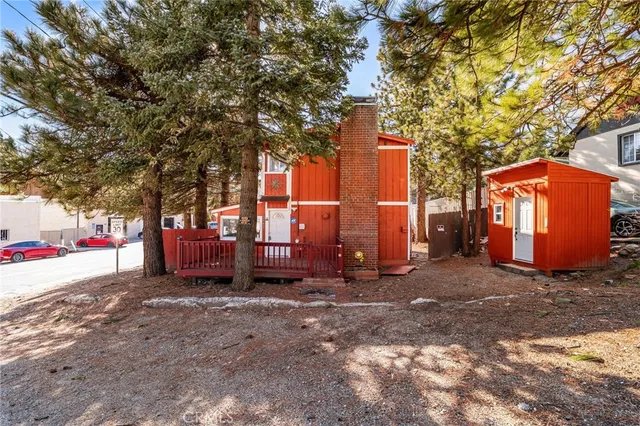 a view of a house with a yard and sitting area