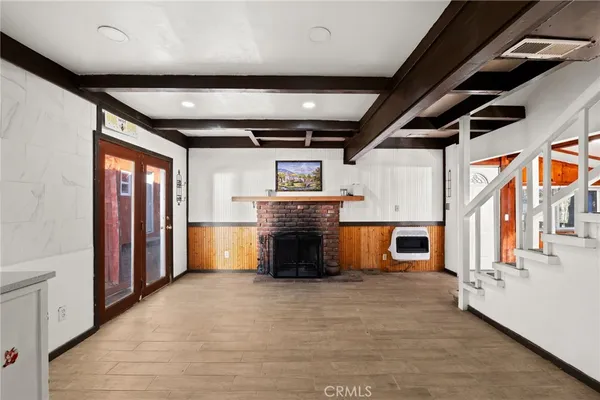 a view of an empty room with a fireplace