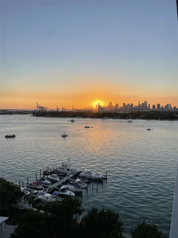 a view of kitchen with table and chairs