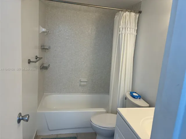 a bathroom with a sink a toilet and a bathtub