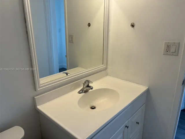a bathroom with a sink and a toilet