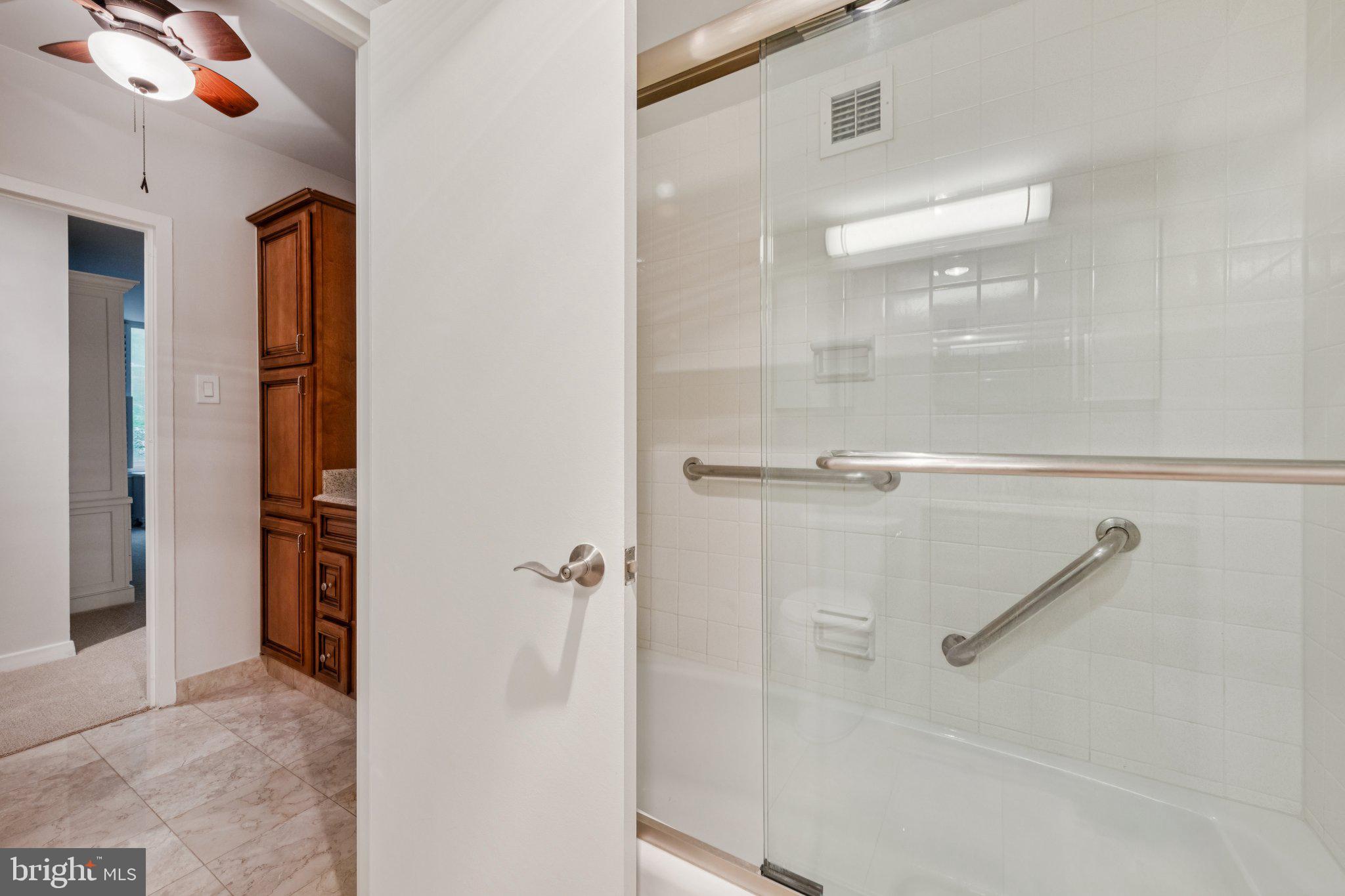 4100 Cathedral Avenue Northwest, Unit 406 Washington, DC 20016 - Photo 13 of 30 a bathroom with a shower