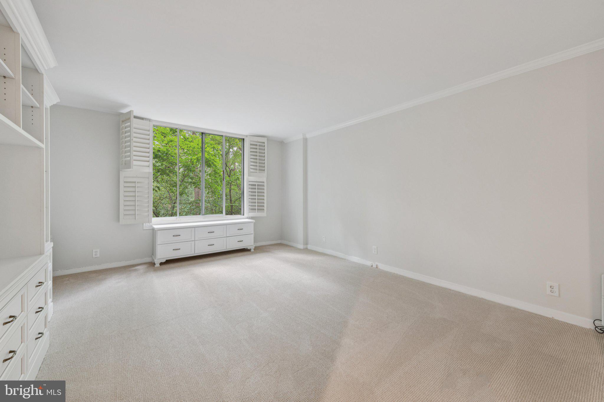 4100 Cathedral Avenue Northwest, Unit 406 Washington, DC 20016 - Photo 9 of 30 an empty room with windows