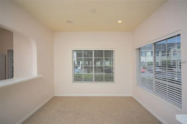 a view of an empty room with a window