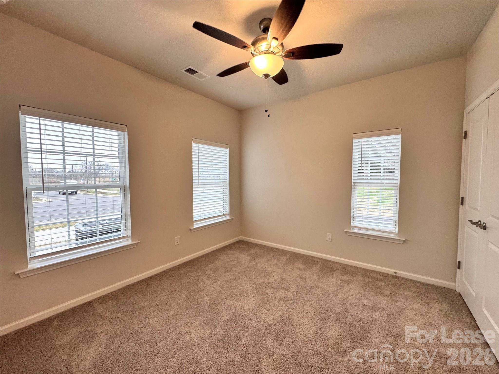 4700 Prosperity Church Road, Unit 6409 Charlotte, NC 28269 - Photo 11 of 23 a view of an empty room with a window