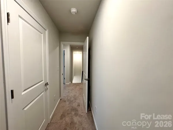 a view of a bathroom from a hallway