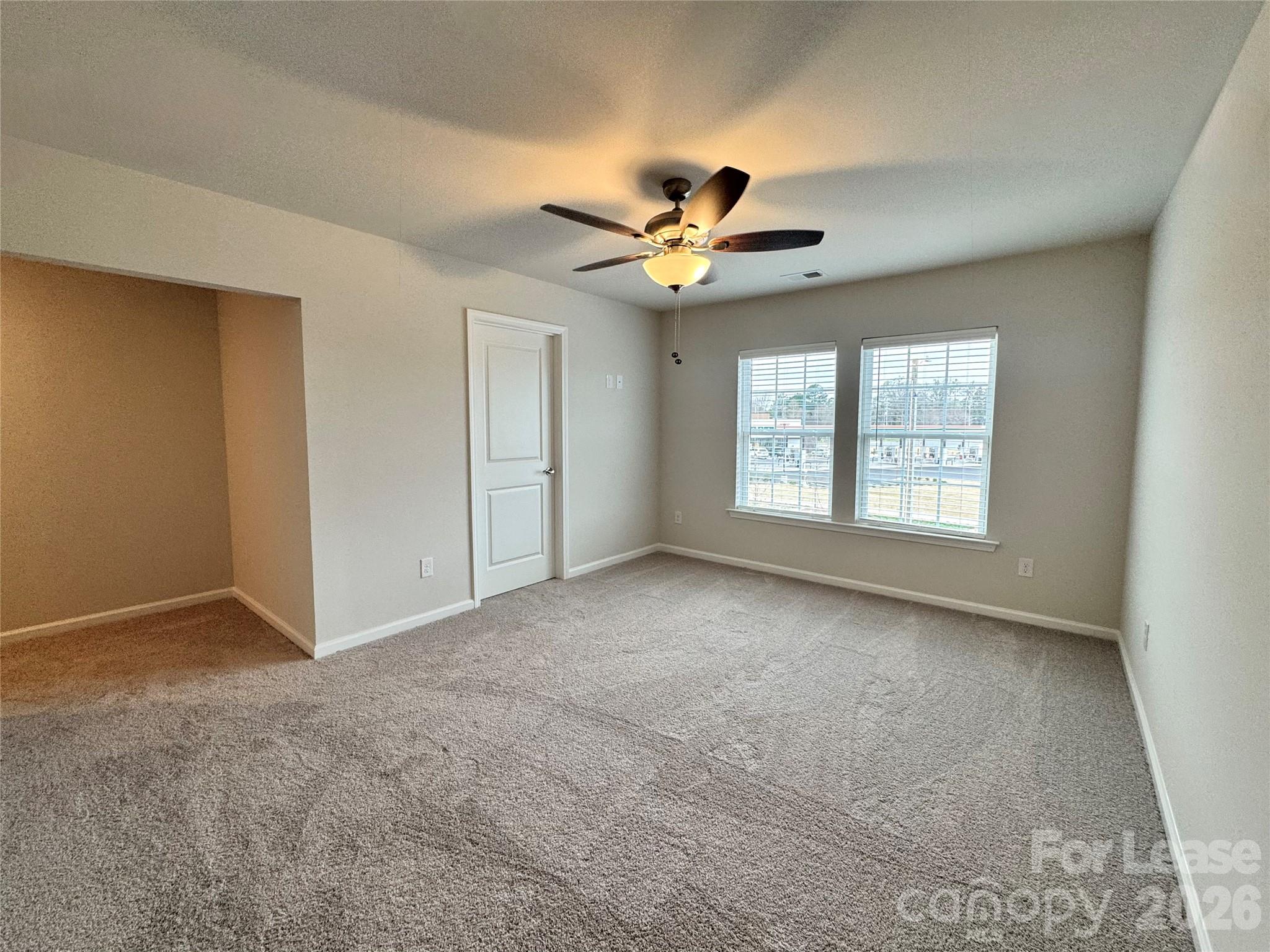 4700 Prosperity Church Road, Unit 6409 Charlotte, NC 28269 - Photo 20 of 23 a view of an empty room with a window