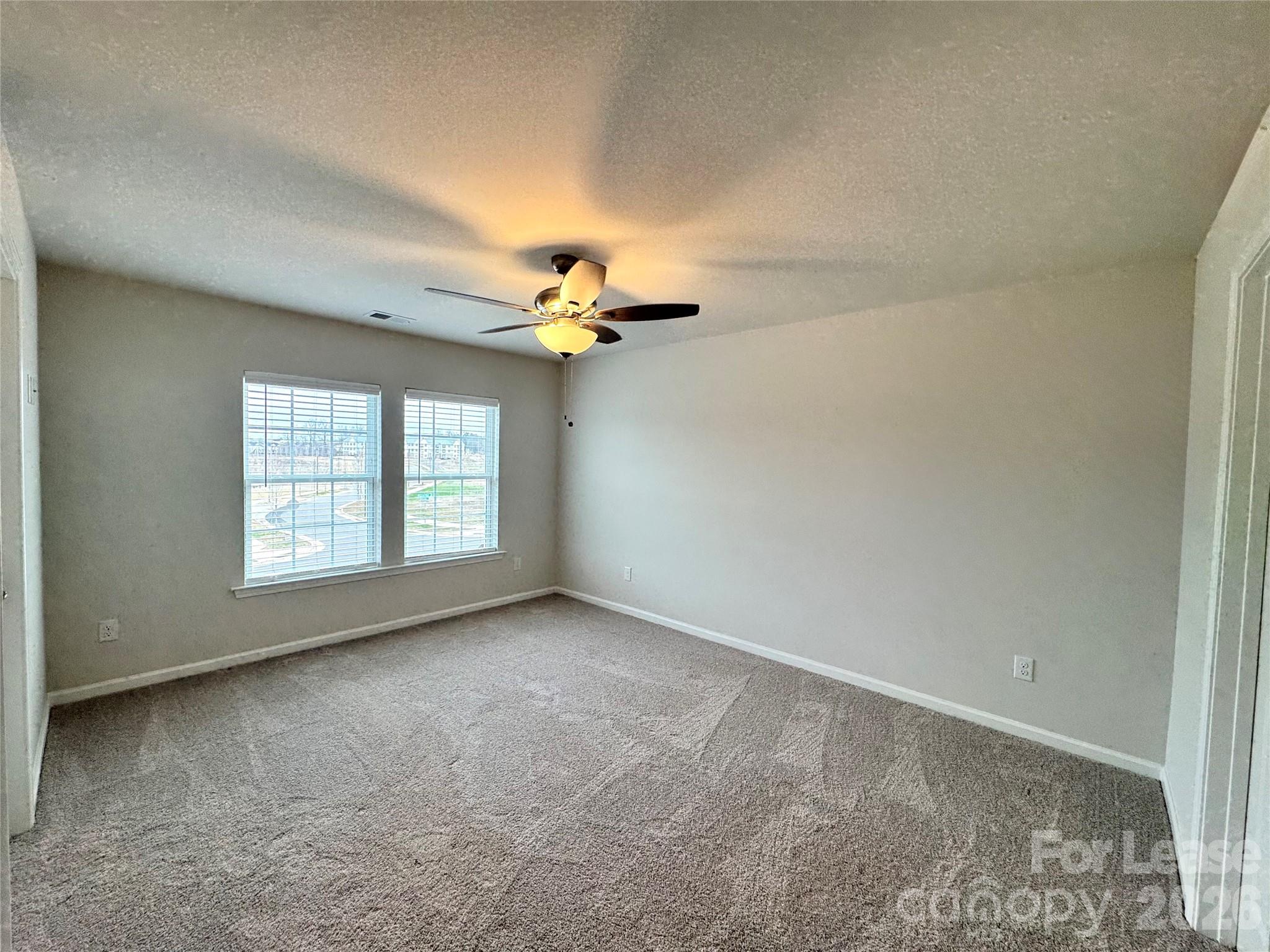 4700 Prosperity Church Road, Unit 6409 Charlotte, NC 28269 - Photo 21 of 23 a view of an empty room with a window