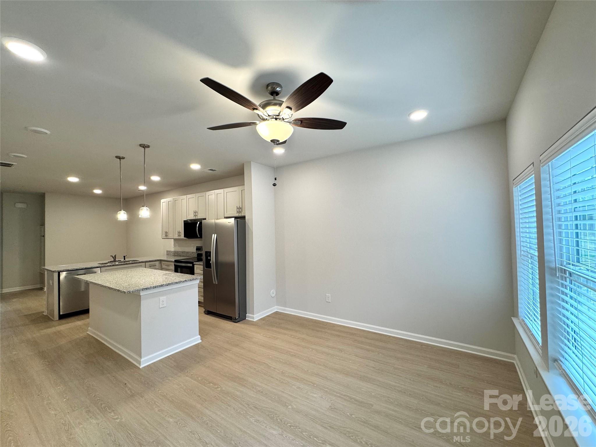 4700 Prosperity Church Road, Unit 6409 Charlotte, NC 28269 - Photo 3 of 23 a kitchen with a refrigerator and a sink