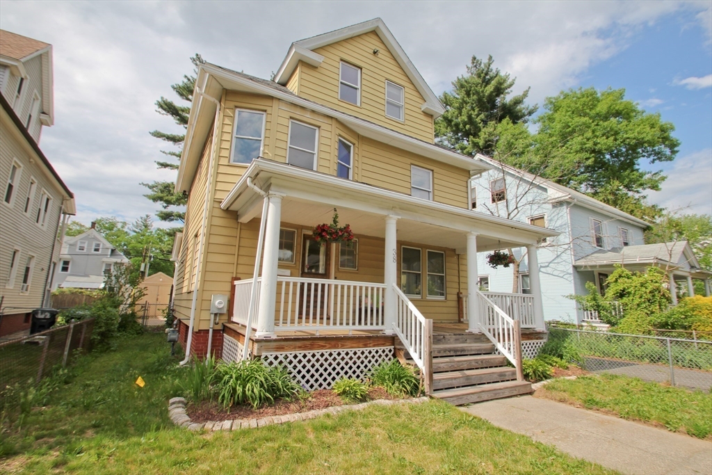 38 Virginia Street Springfield, MA 01108 - Photo 41 of 42 a front view of a house with a yard