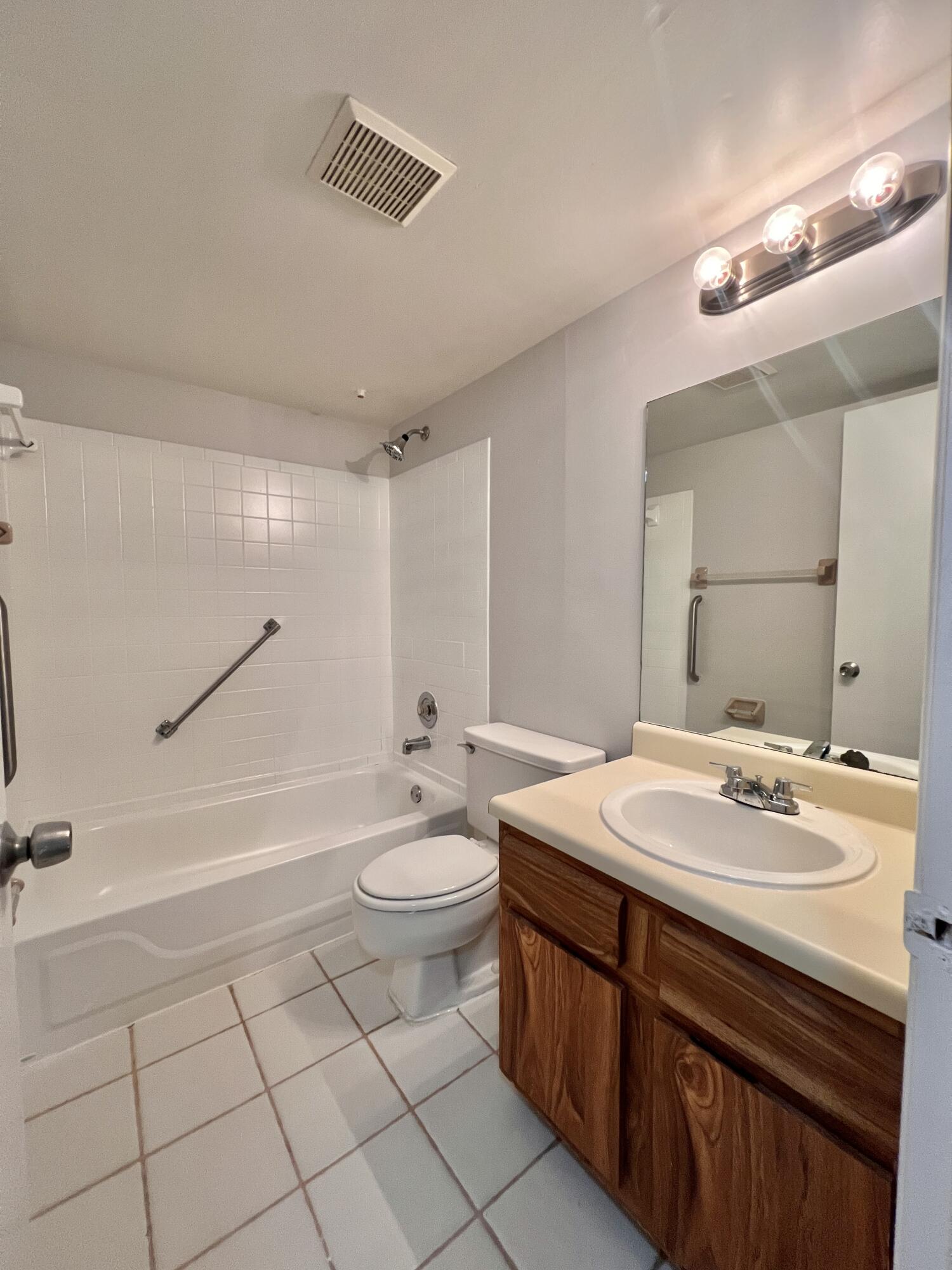 150 Pineview Road, Unit J5 Jupiter, FL 33469 - Photo 13 of 35 a bathroom with a sink a toilet and shower