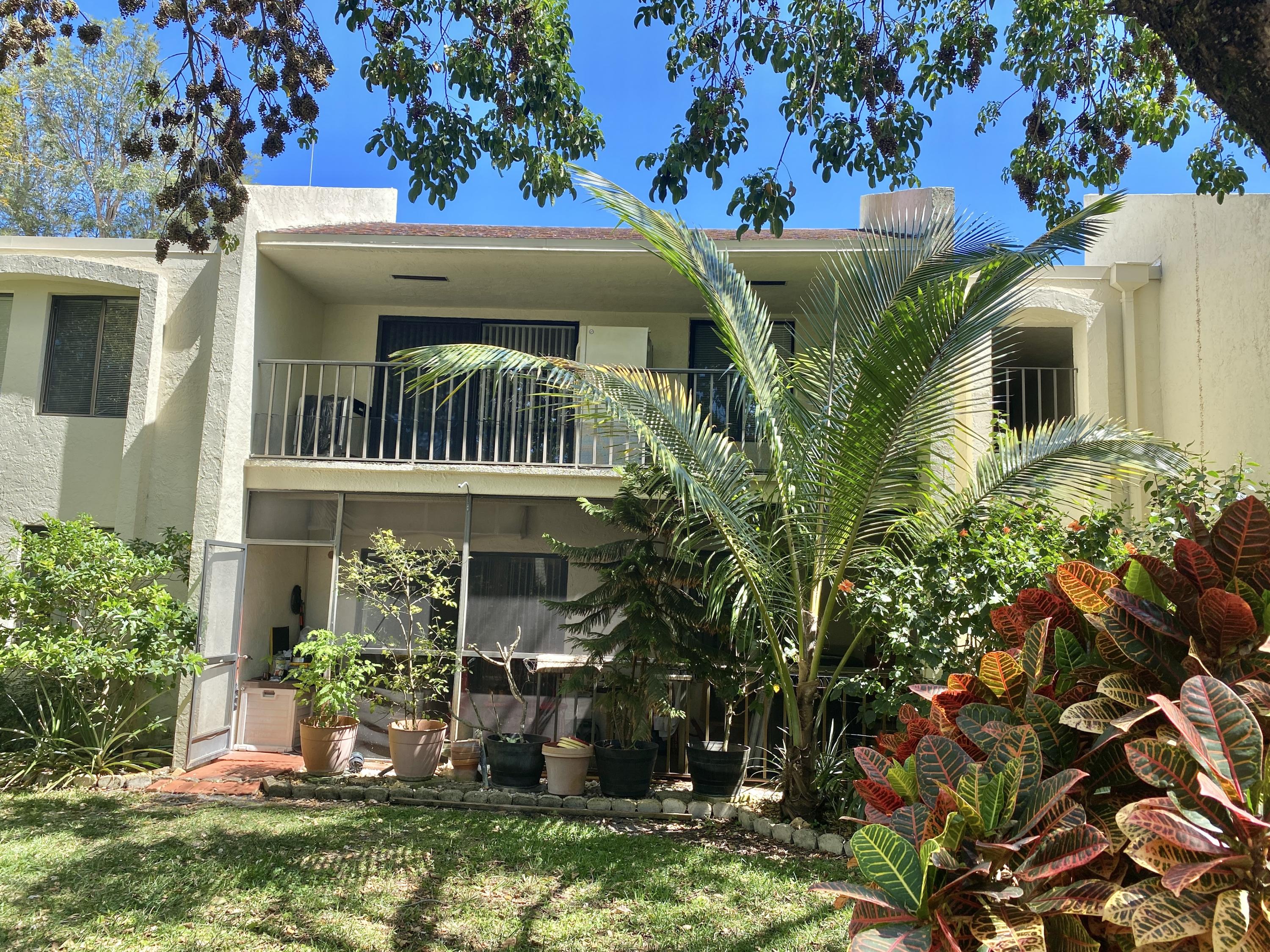 150 Pineview Road, Unit J5 Jupiter, FL 33469 - Photo 22 of 35 a view of a house with a yard