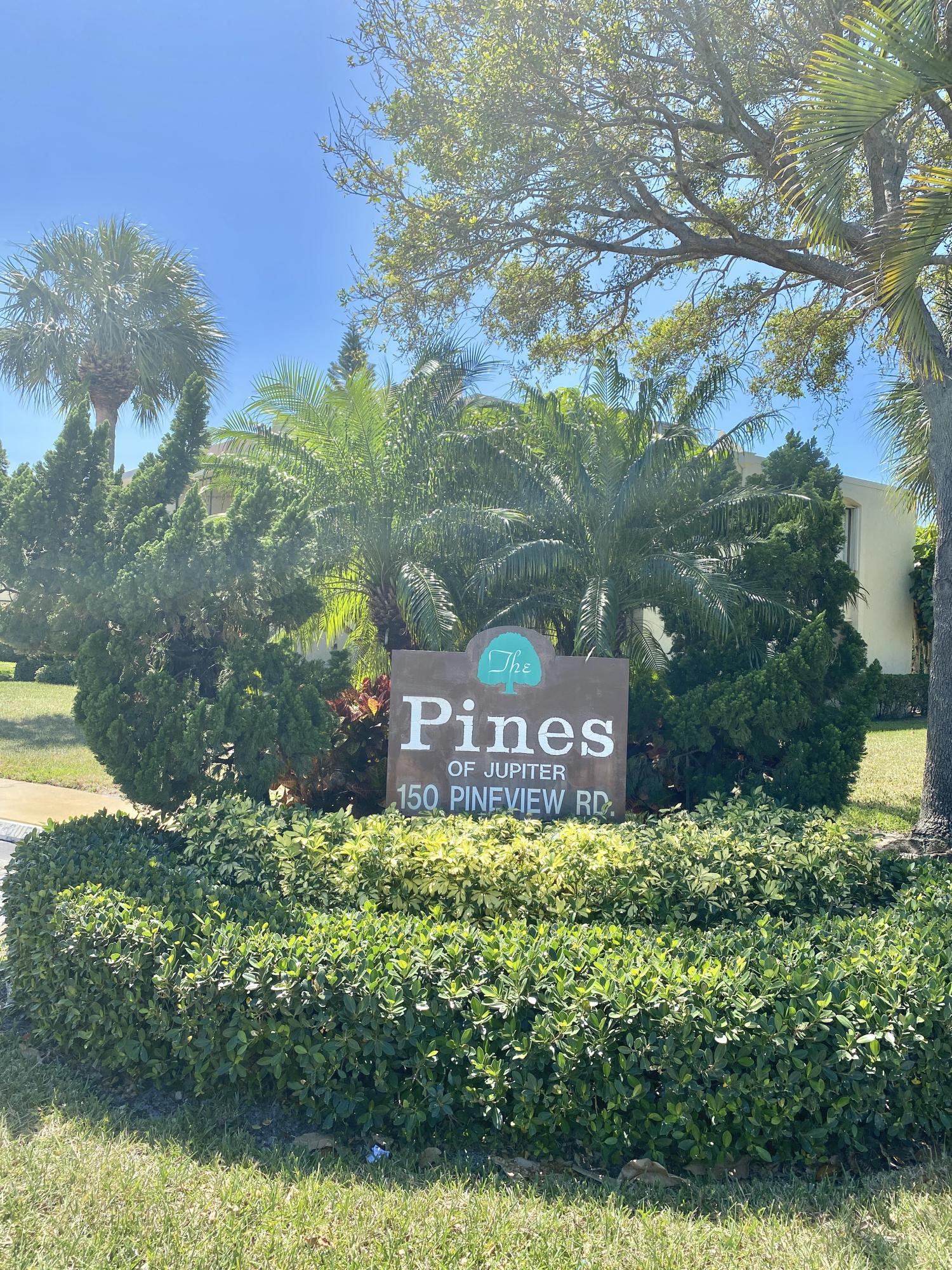 150 Pineview Road, Unit J5 Jupiter, FL 33469 - Photo 26 of 35 a view of a sign board with a lake view