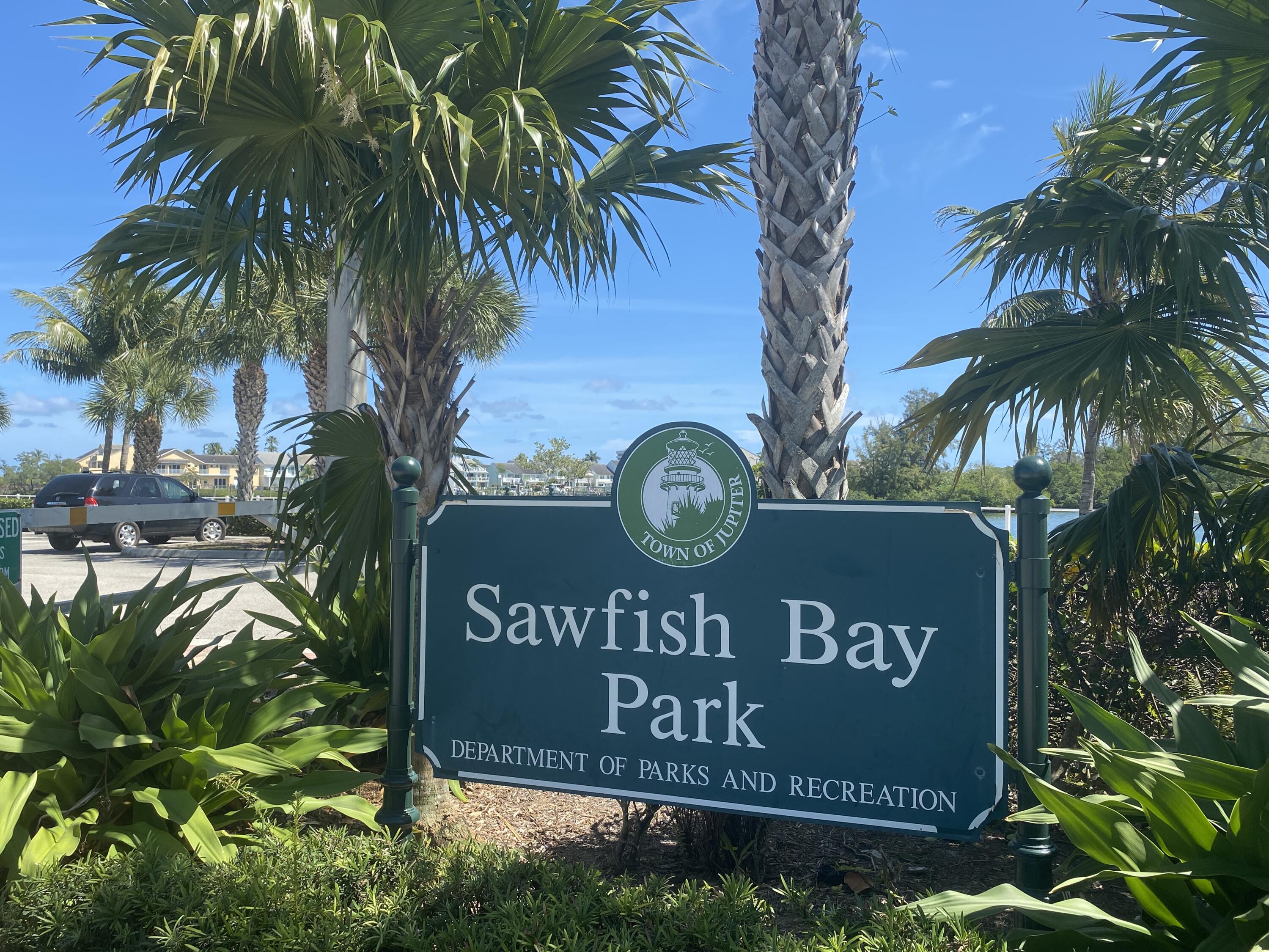 150 Pineview Road, Unit J5 Jupiter, FL 33469 - Photo 27 of 35 a sign broad on the side of a building