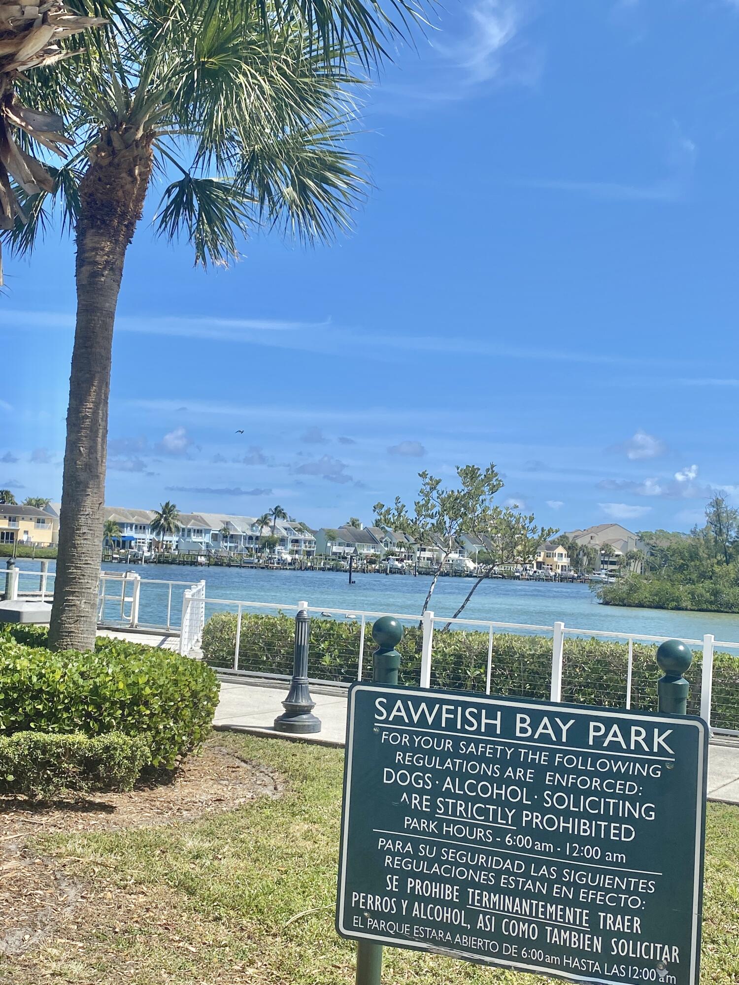 150 Pineview Road, Unit J5 Jupiter, FL 33469 - Photo 29 of 35 a view of a lake with a yard