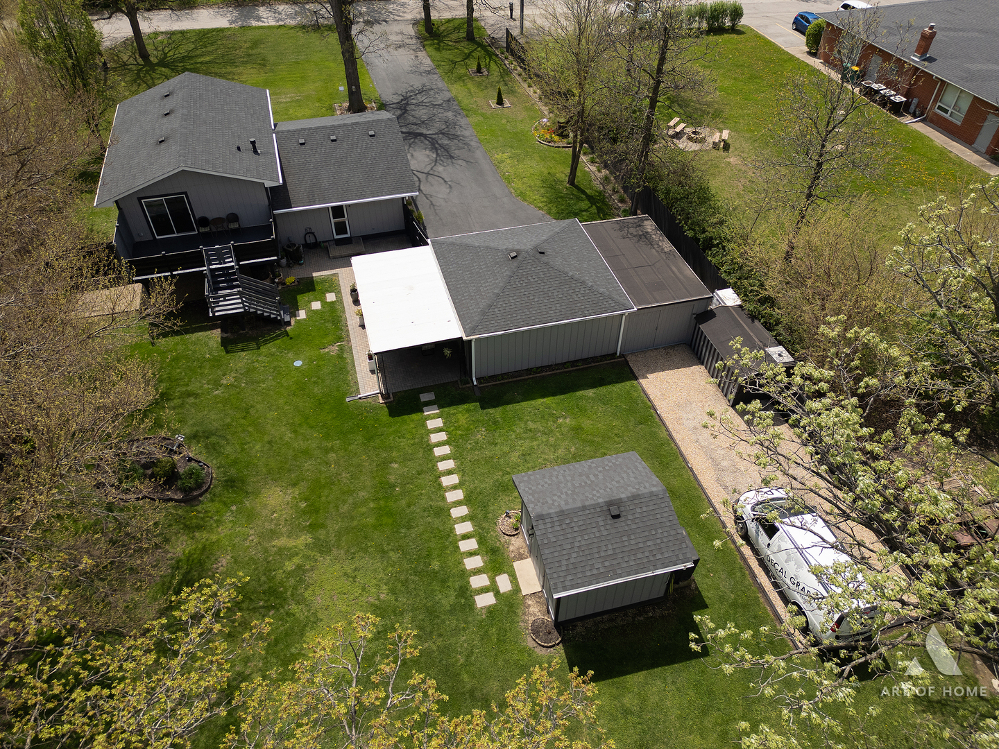 an aerial view of a house with a garden