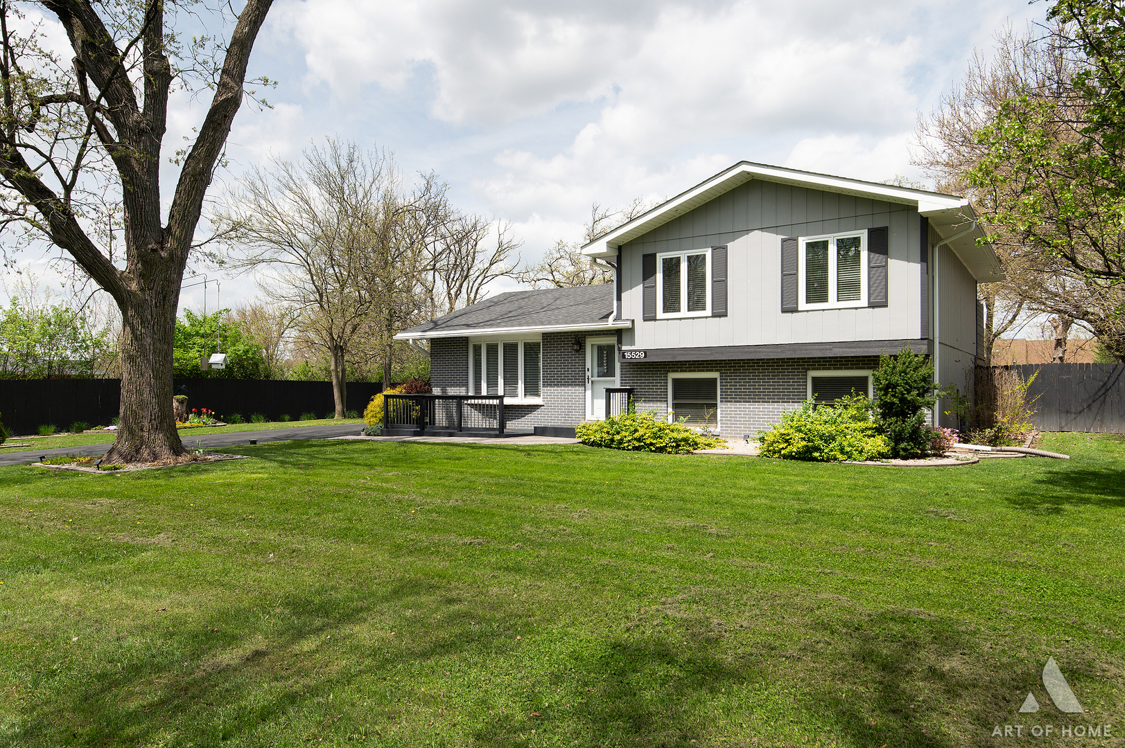 15529 129th Street Lemont, IL 60439 - Photo 2 of 65 a front view of a house with a garden