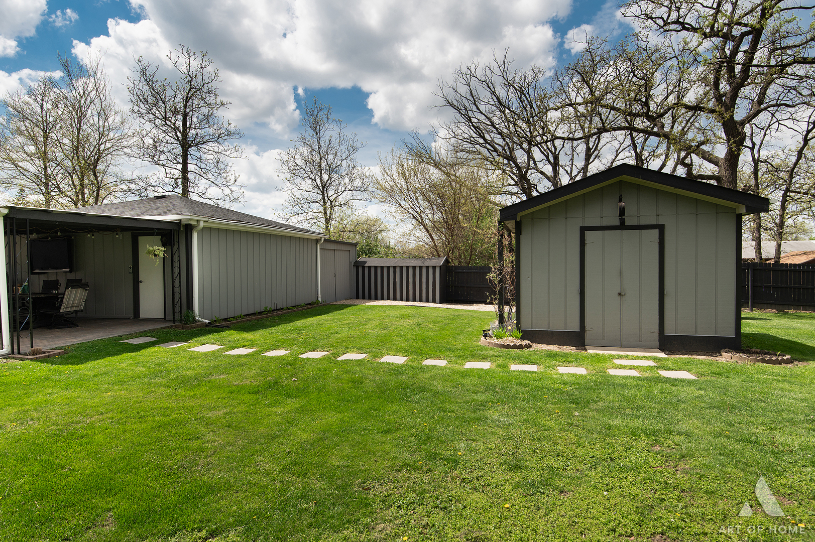 15529 129th Street Lemont, IL 60439 - Photo 53 of 65 a house that is sitting in the grass with tress in the background