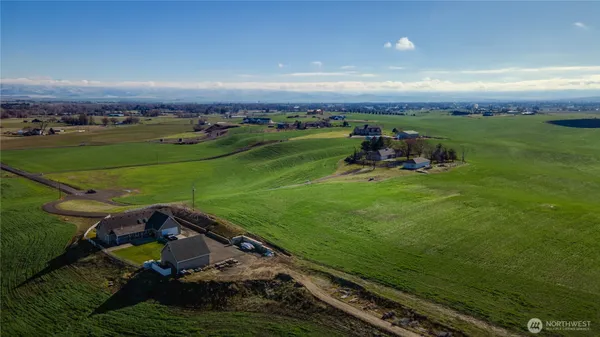 an aerial view of a golf course with chairs