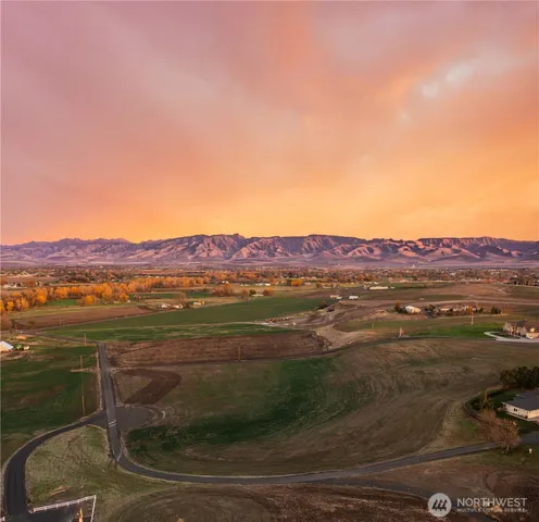 a view of an ocean with a mountain