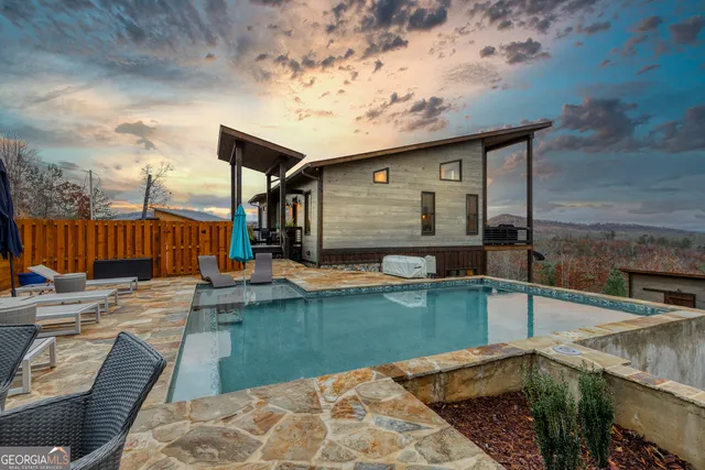 a large kitchen with a large window and stainless steel appliances