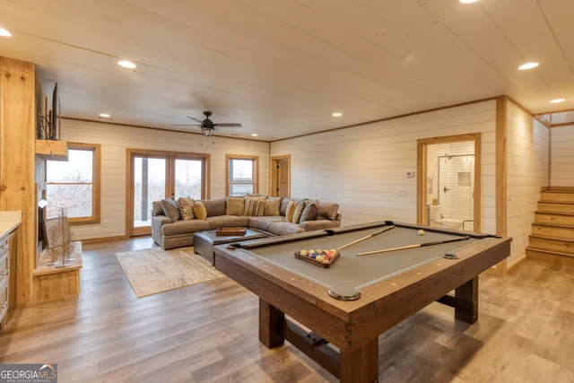 a view of a balcony with furniture and floor to ceiling window