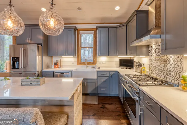 a bathroom with a double vanity sink large mirror and shower