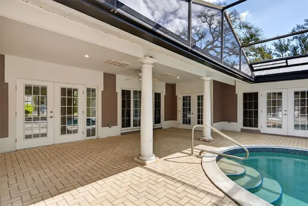 a view of a swimming pool with a patio