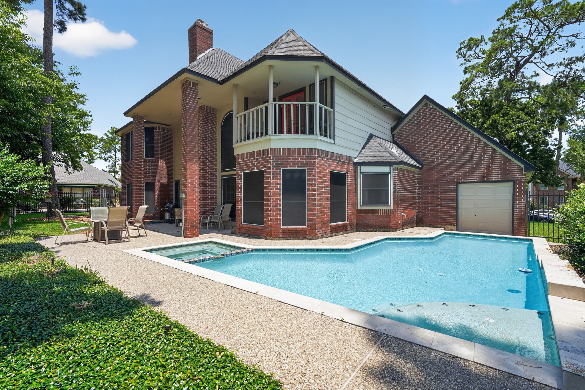 19027 Relay Road Humble, TX 77346 - Photo 27 of 29 Backyard view of the pool and house exterior.
