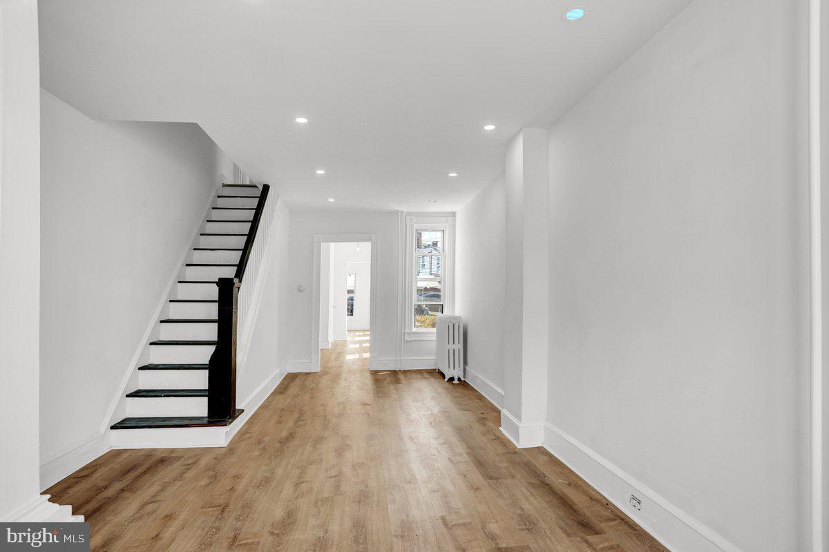 1649 North 9th Street Reading, PA 19604 - Photo 1 of 3 a view of a room with wooden floor and stairs