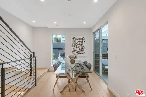 a bedroom with a bed and a mirror