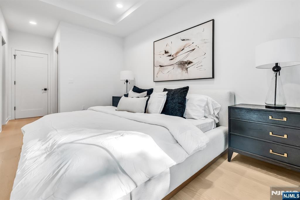 5 Fey Place Oradell, NJ 07649 - Photo 13 of 30 a bedroom with a bed and painting on the wall