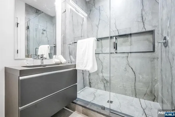 a bathroom with a sink and mirror