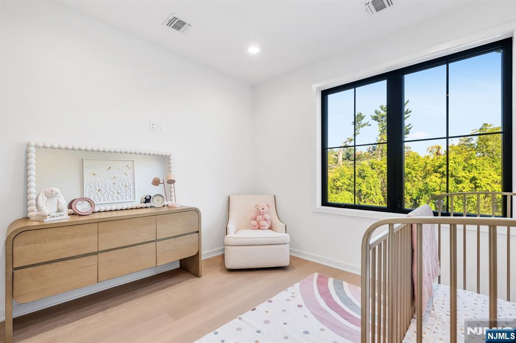 5 Fey Place Oradell, NJ 07649 - Photo 23 of 30 a bedroom with a bed and window