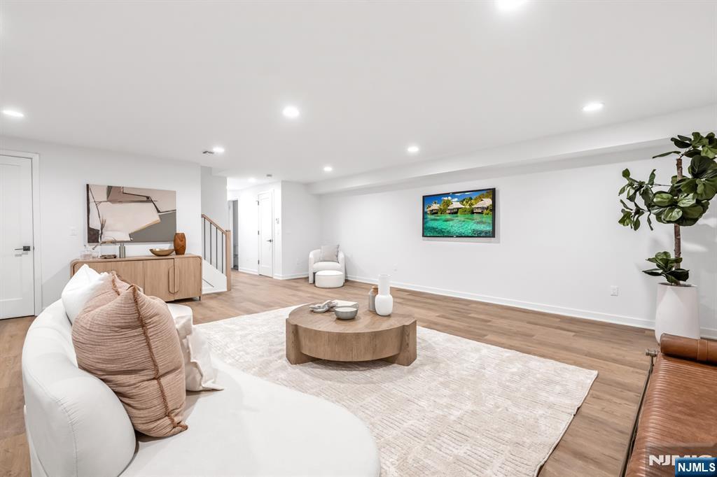 5 Fey Place Oradell, NJ 07649 - Photo 25 of 30 a living room with furniture and a potted plant