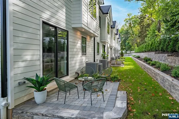 a view of yard with patio