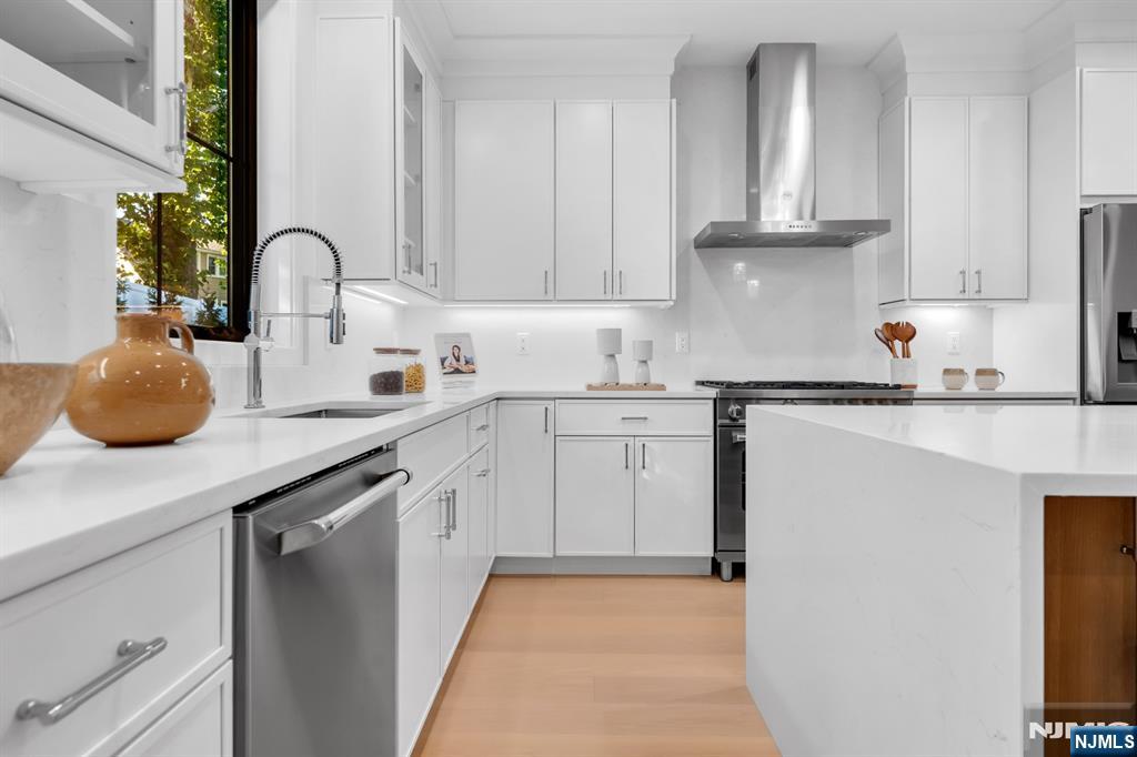 5 Fey Place Oradell, NJ 07649 - Photo 8 of 30 a kitchen with white cabinets a sink and white appliances