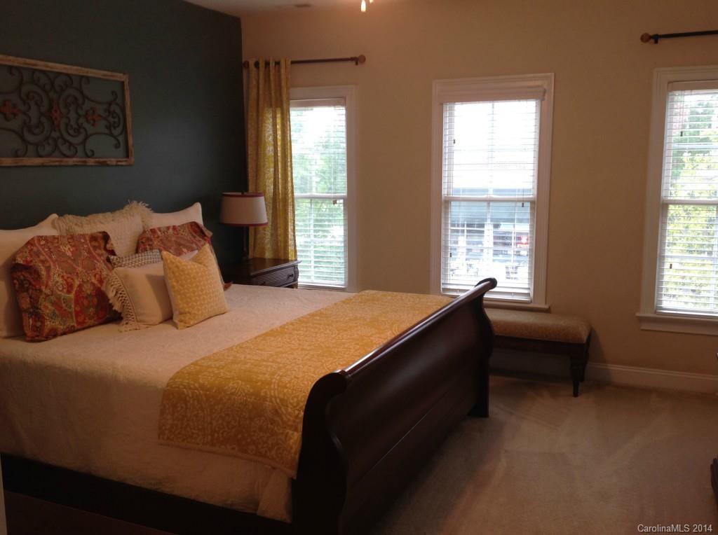 1195 Springmaid Avenue Fort Mill, SC 29708 - Photo 13 of 22 a bedroom with a bed and a window