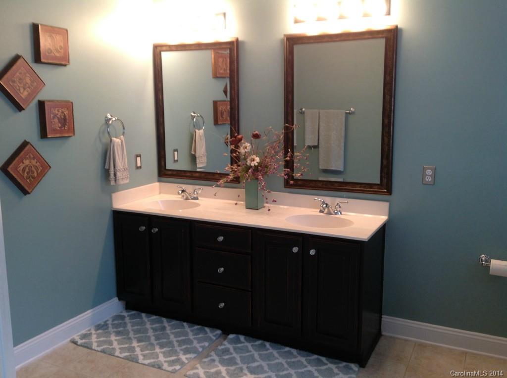 1195 Springmaid Avenue Fort Mill, SC 29708 - Photo 15 of 22 a bathroom with a sink and a mirror