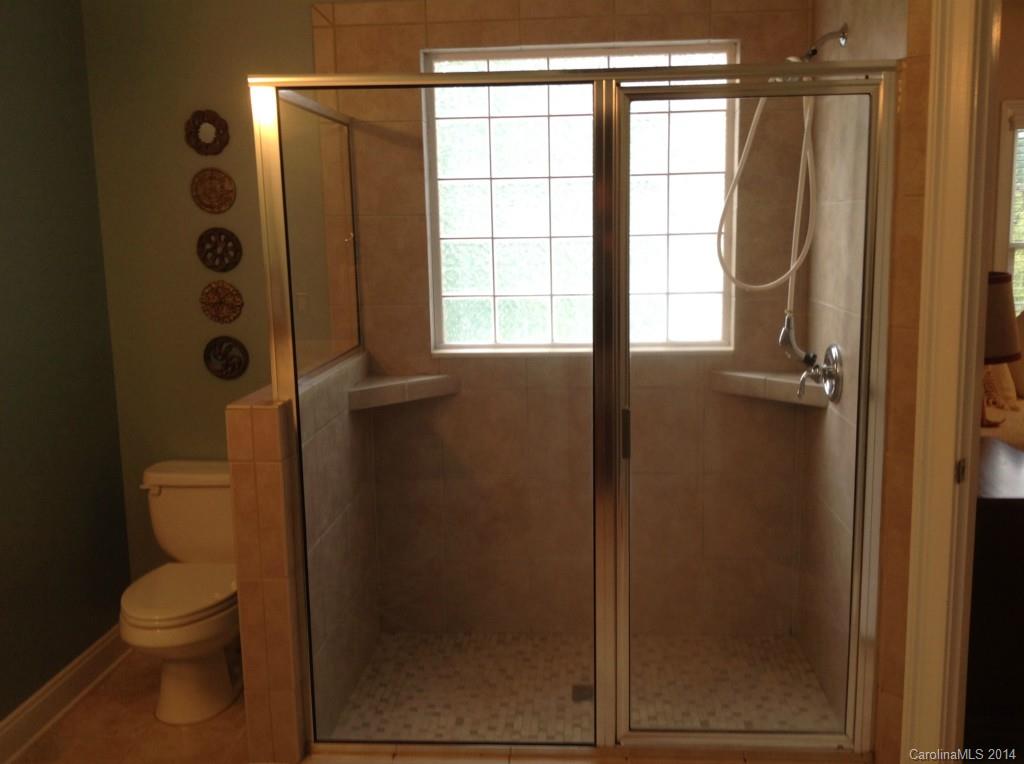 1195 Springmaid Avenue Fort Mill, SC 29708 - Photo 16 of 22 a bathroom with a toilet and a shower