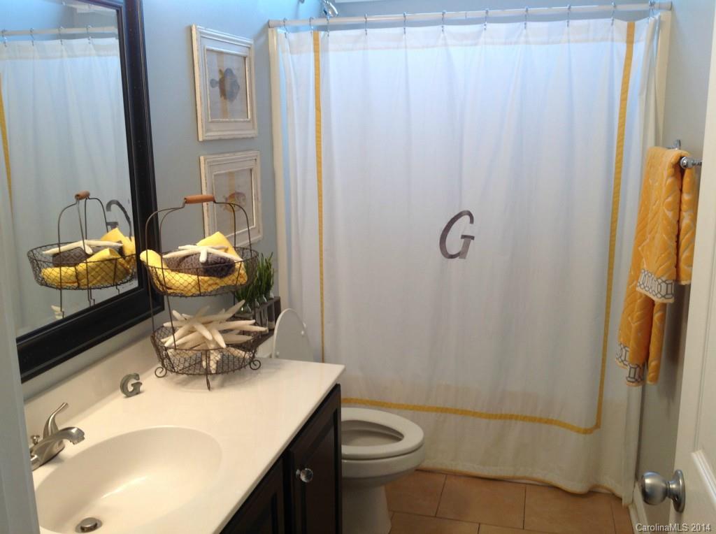 1195 Springmaid Avenue Fort Mill, SC 29708 - Photo 17 of 22 a bathroom with a sink toilet and shower